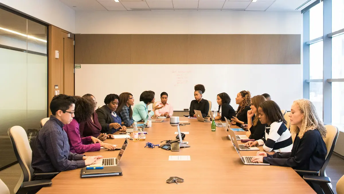 Image of people at a conference table