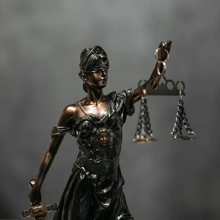 Image of Lady Justice holding her scales